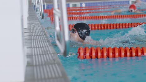 swimmers swimming into the pool