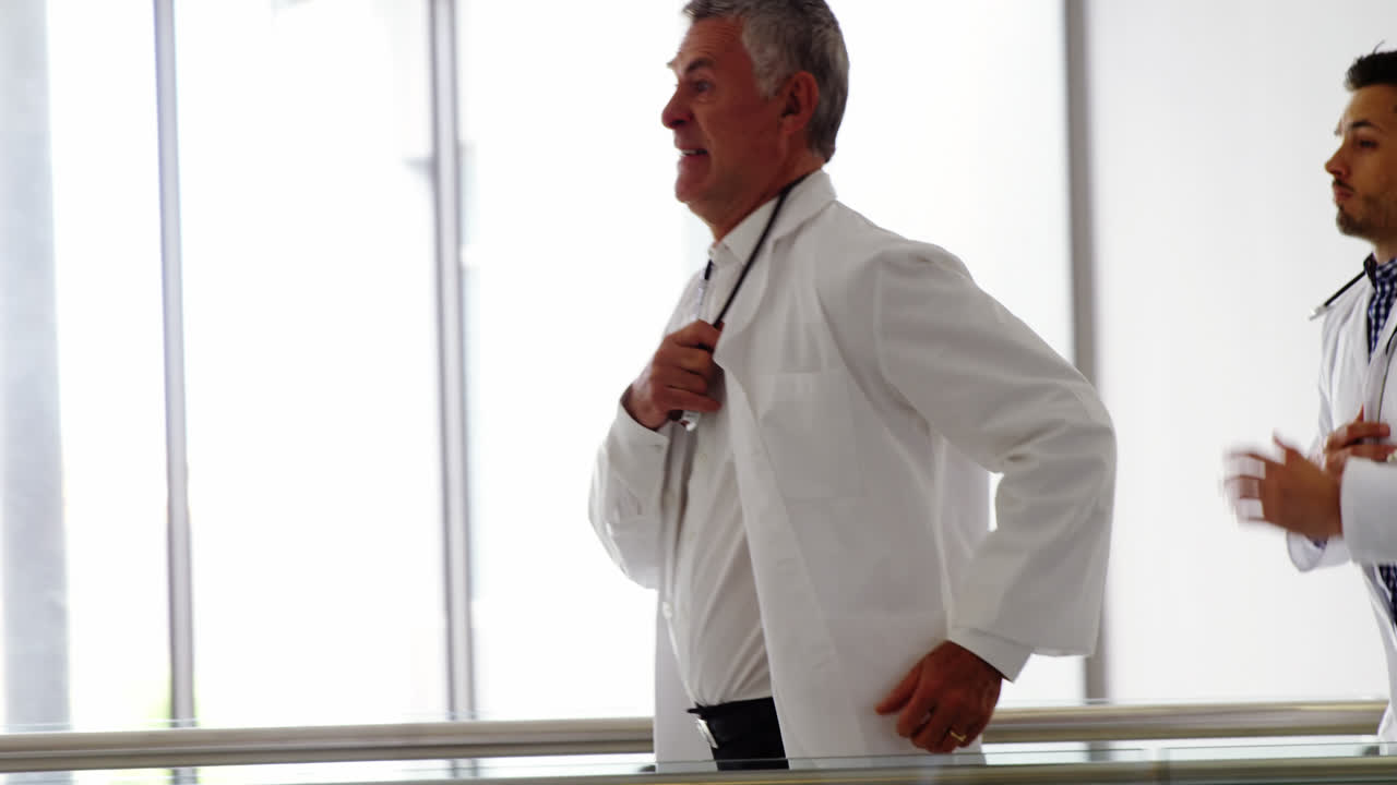 Doctor running in passageway of hospital