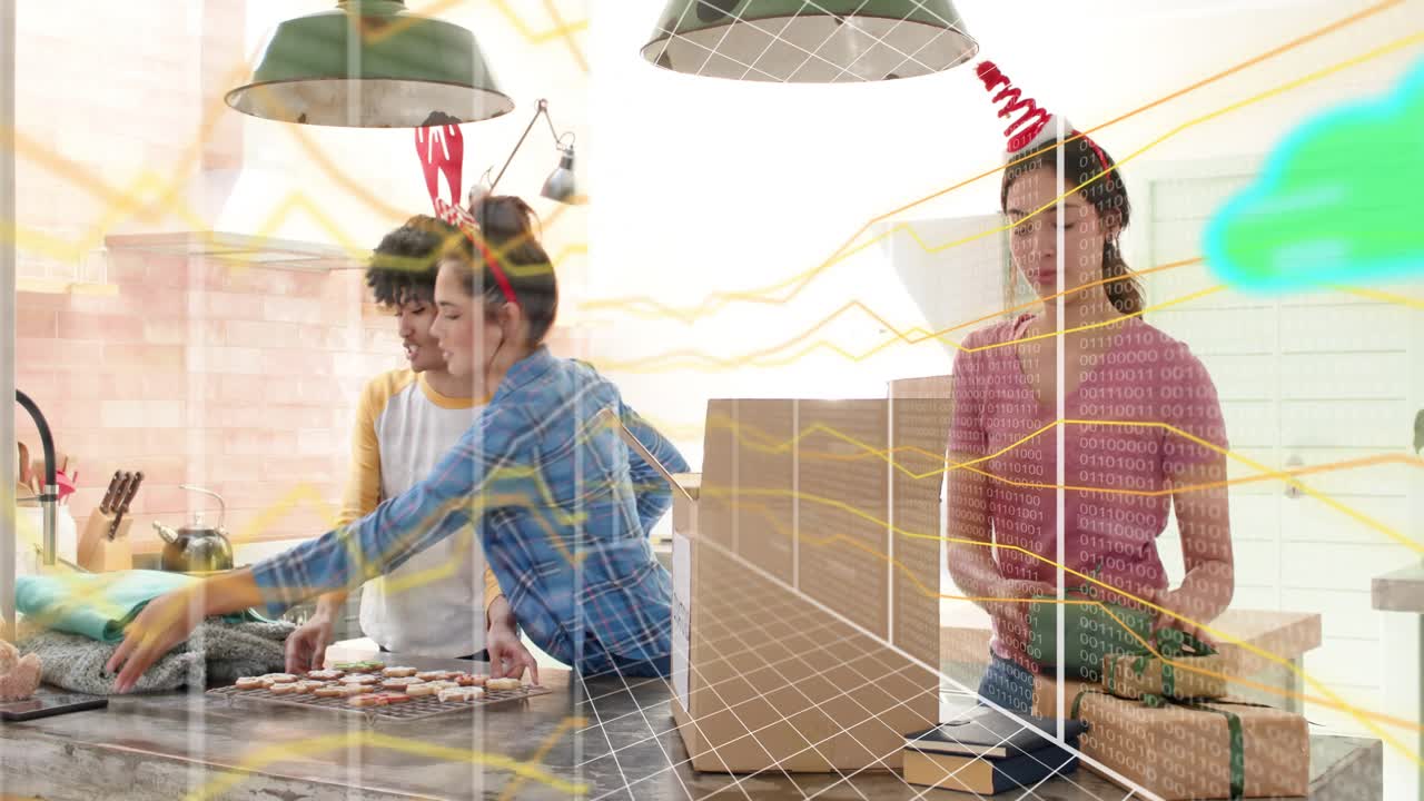 Three women arranging holiday cookies in kitchen, smartphone over tray activating animated clouds