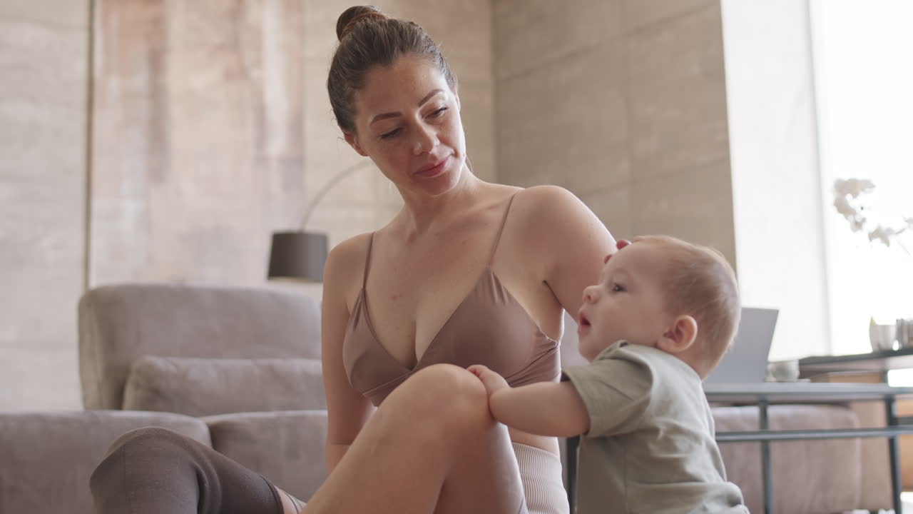 Female Yogi with Disability Babysitting and Meditating