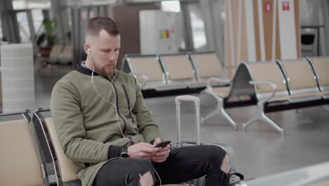 man waiting at airport lounge