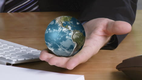 Businessman-with-a-globe-in-his-hand