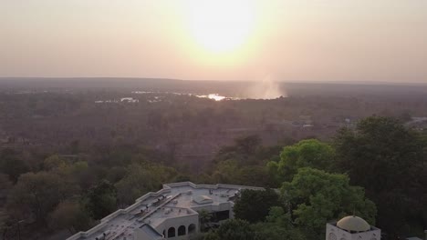 morning aerial over rainbow hotel toward famous victoria falls beyond