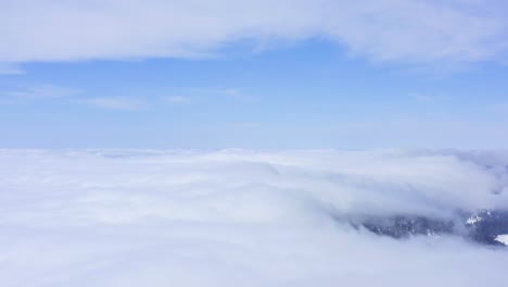 A-beautiful-shot,-drone-flying-among-the-clouds-at-high-altitude,-California