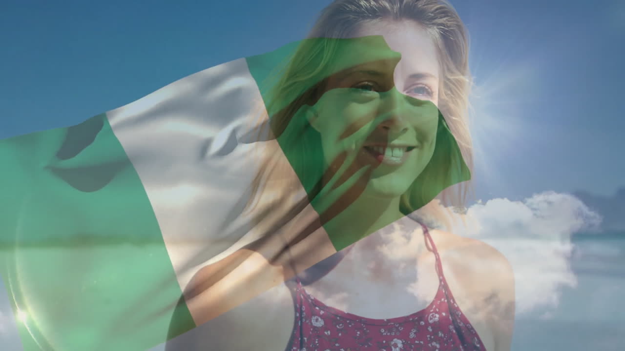 Holding Nigeria flag, woman smiling against blue sky with animation elements