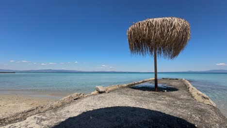 stunning beach scene in halkidiki, greece, with elegant sunbeds facing the crystal-clear turquoise sea. a perfect summer escape in the heart of the aegean.
