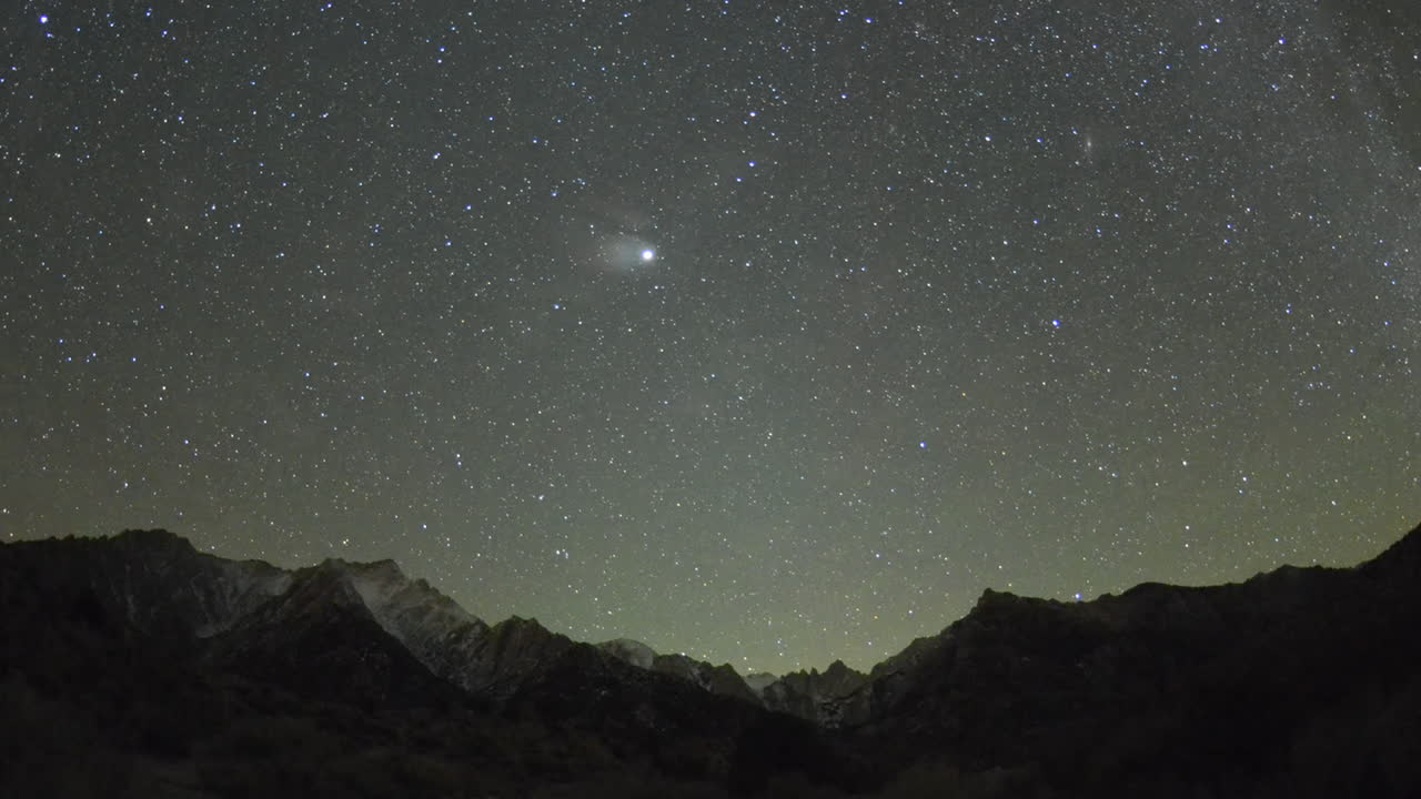 Moonrise and star time lapse above Mount Whitney in the Sierra Nevada Mountains near Lone Pine California