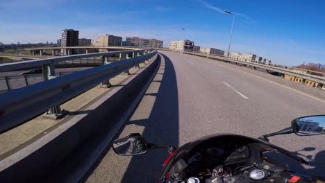 motorcycle ride through city on sunny day