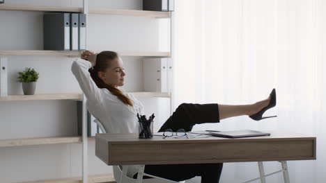 woman relaxing at her desk