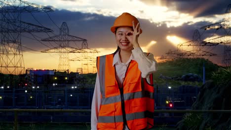 female engineer at power plant during sunrise