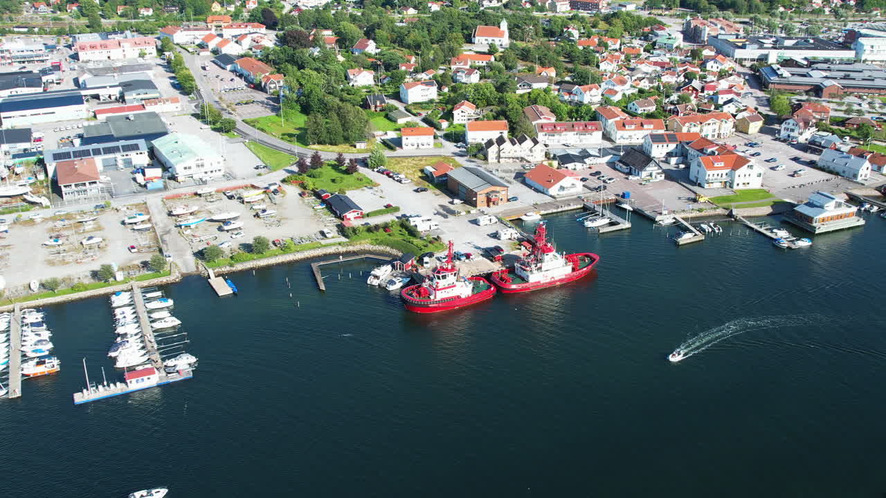 Towboats moored at the harbor in Stenungsund, Sweden, under sunny weather