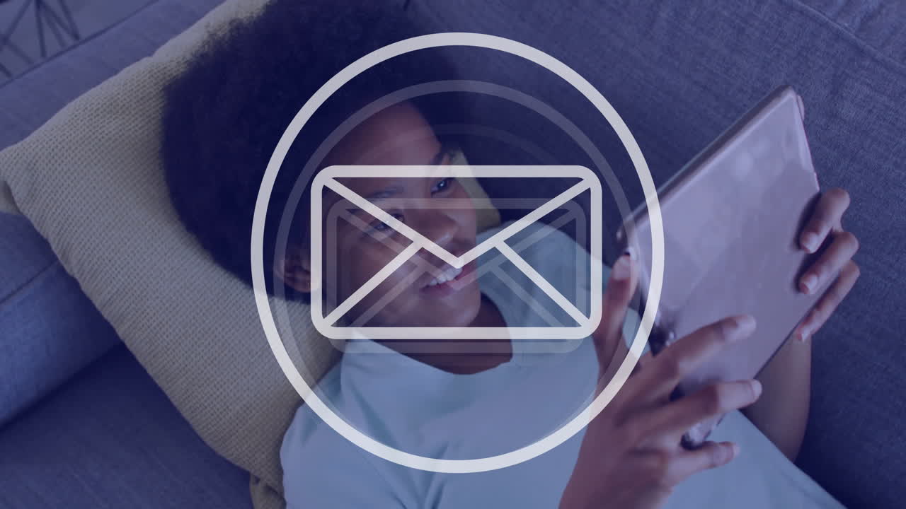 In school, child using tablet with animation of email icon on screen