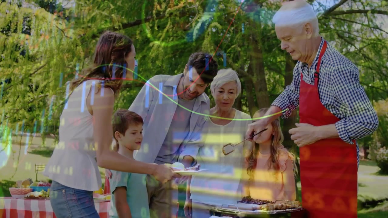 grandfather grabbing tongs and placing sausages on grill as family gathering for barbecue