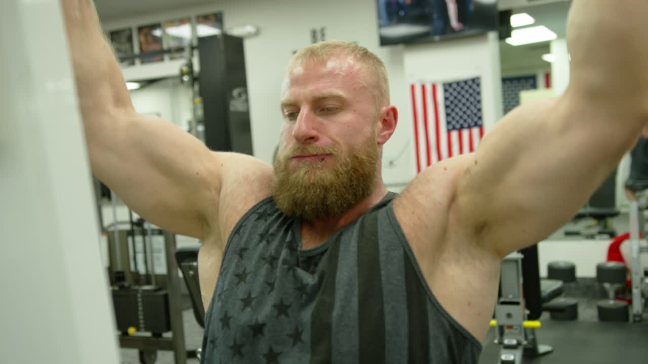 Strong bodybuilder strength workout in sport club