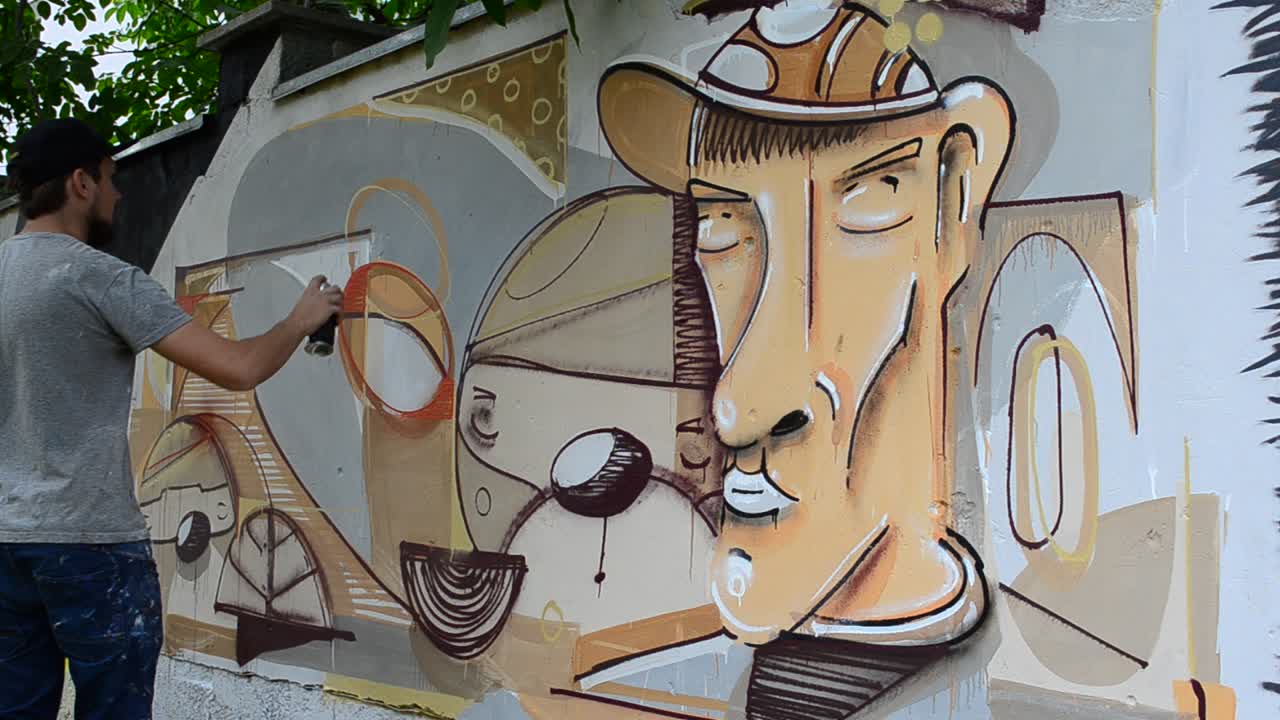 Kunstneren tegner graffiti, bilde av personen med en pipe
