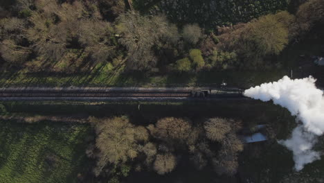 Steam-Train-in-travelling-through-English-Countryside---Drone-Shot,-top-down