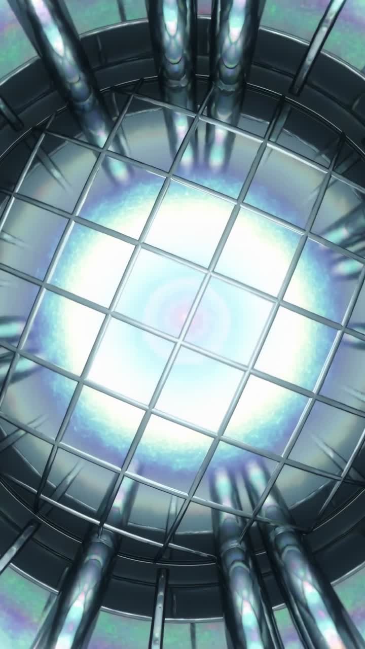 Vertical video: Moving camera showing square metal grid over bright emitter in metal chamber, pipes