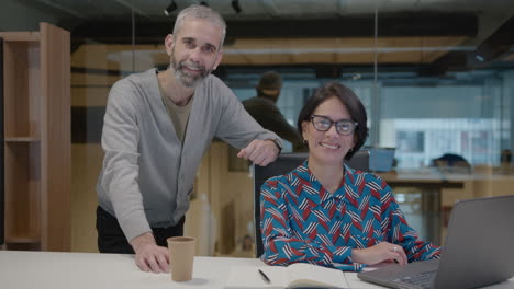 portrait of senior businessman with mature female colleague in office