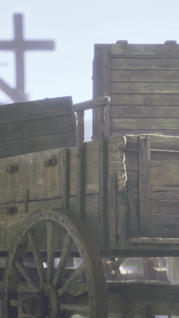 Old wooden cart resting in a misty harbor during early morning hours