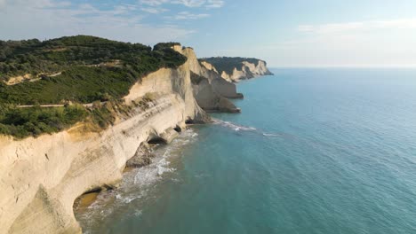 beautiful drone flight above cape drastis cliffs at golden hour