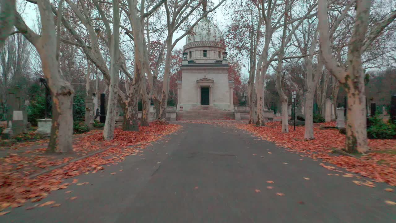Autumnal Path Leading to a Mausoleum in a Historic Cemetery