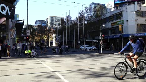 pedestrians and cyclist crossing a city street