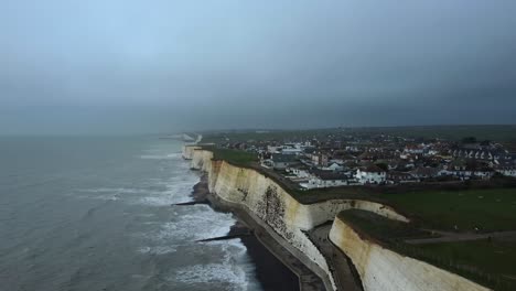 dramatic storm on coast of england with cliffs and dark grey clouds