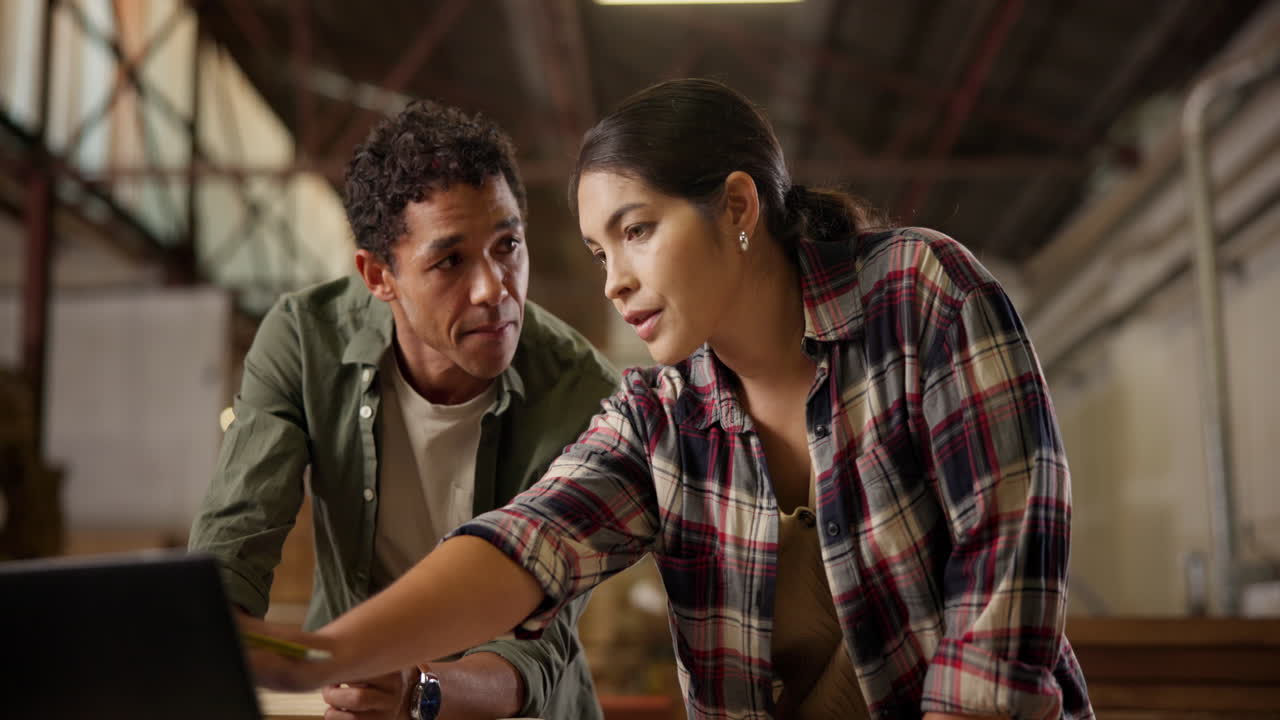 Two People Collaborating in a Workshop