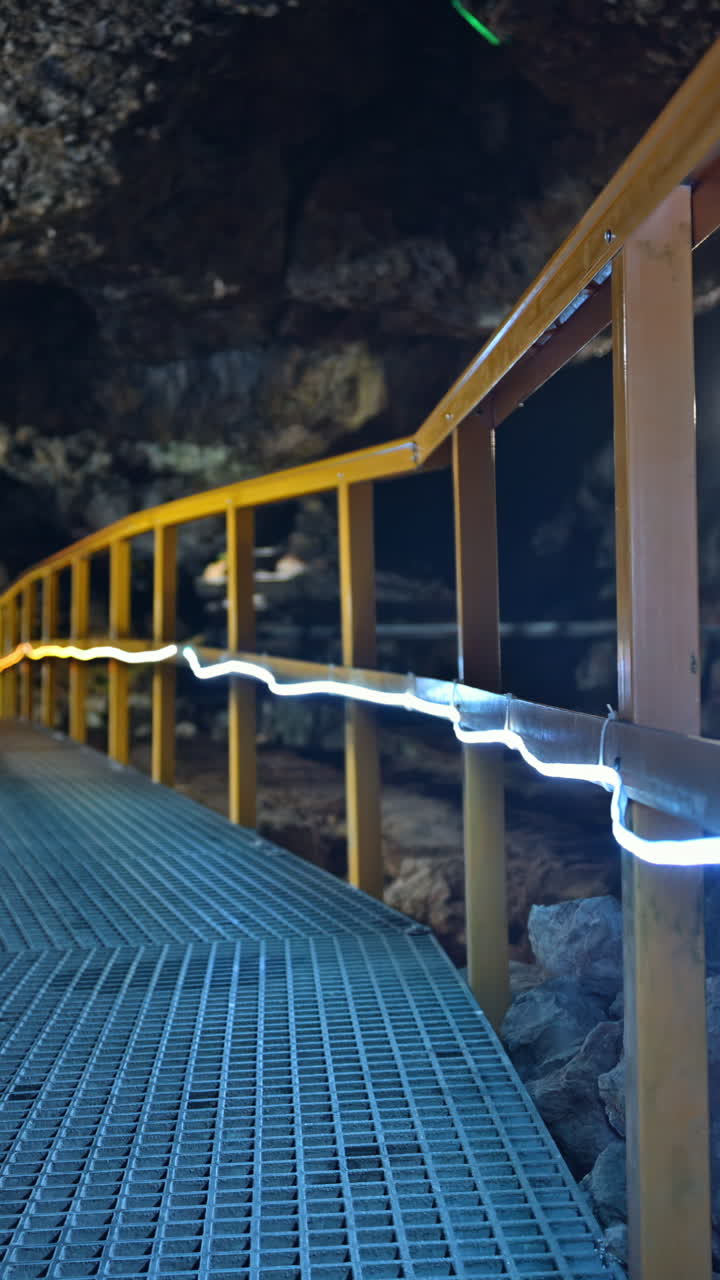 Stairs and rails inside of the Ialomita Cave in the Bucegi Mountains in Romania. Vertical