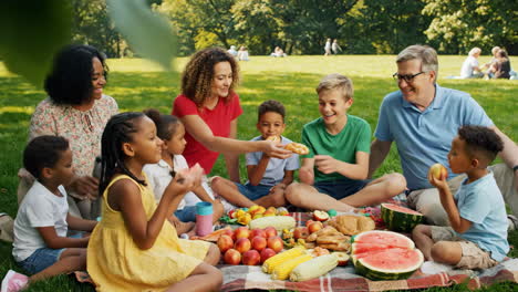 diverse family enjoying a summer picnic in the park