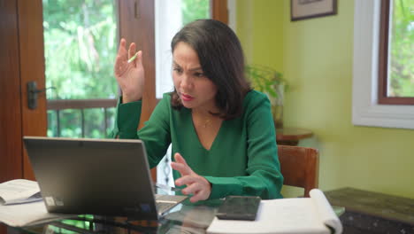 Nervous-and-Confused-Asian-Business-Woman-Working-on-Computer-Laptop-at-Home-Office,-Wide-Shot