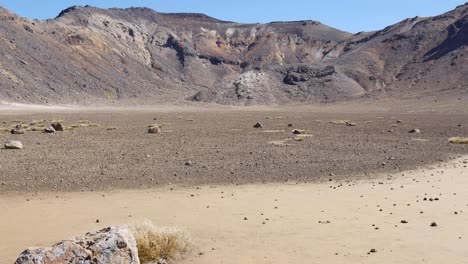 pan across rugged volcanic ash landscape in tongariro national park