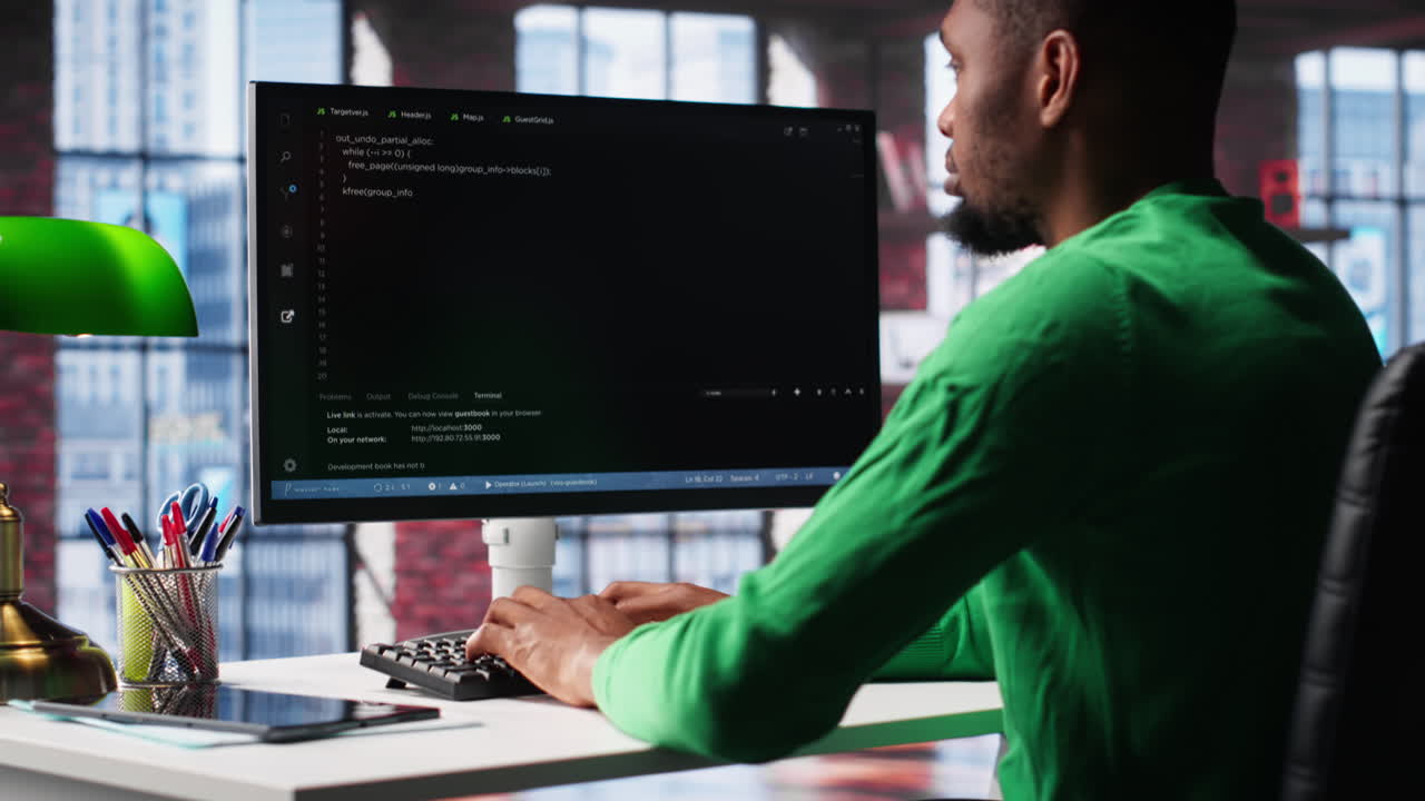 Vertical Video African american software developer does visual coding and creating software