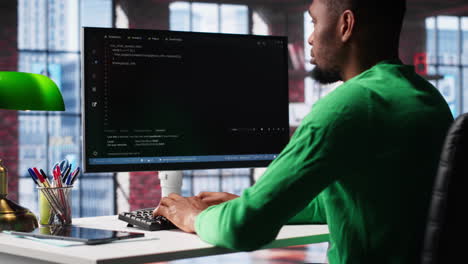 vertical video african american software developer does visual coding and creating software