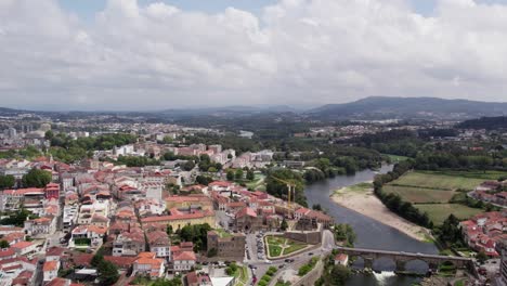 Barcelos-Skyline-with-Medieval-Bridge,-Portugal---aerial