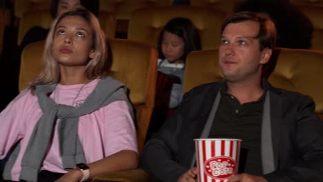 people audience watching movie in cinema theater.