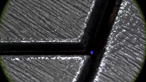 close-up of a welding or cutting process on metal with intense light and sparks
