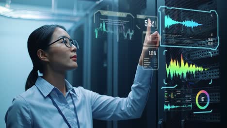 a technician analyzes performance metrics on digital displays in a server room at night. the atmosphere is focused and high-tech, showcasing data management and analysis tasks.