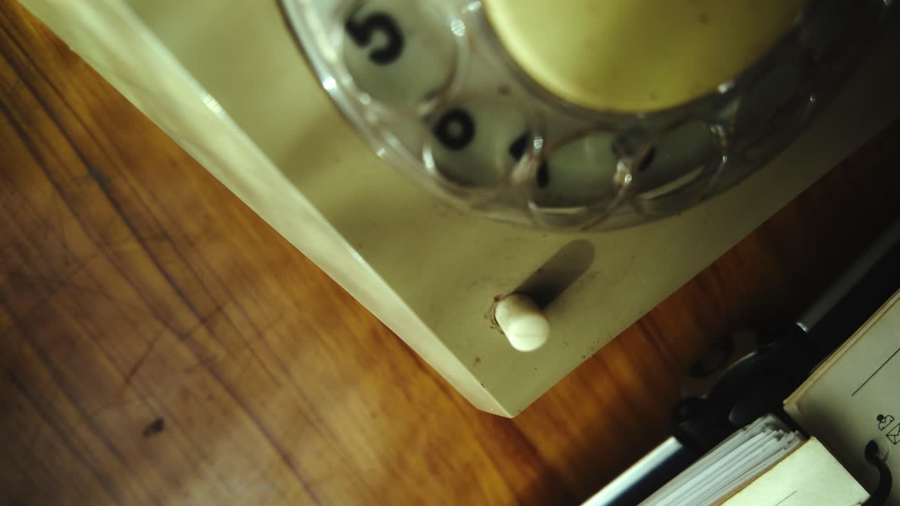 Finger dialling rotary telephone then pressing reset button CLOSE-UP