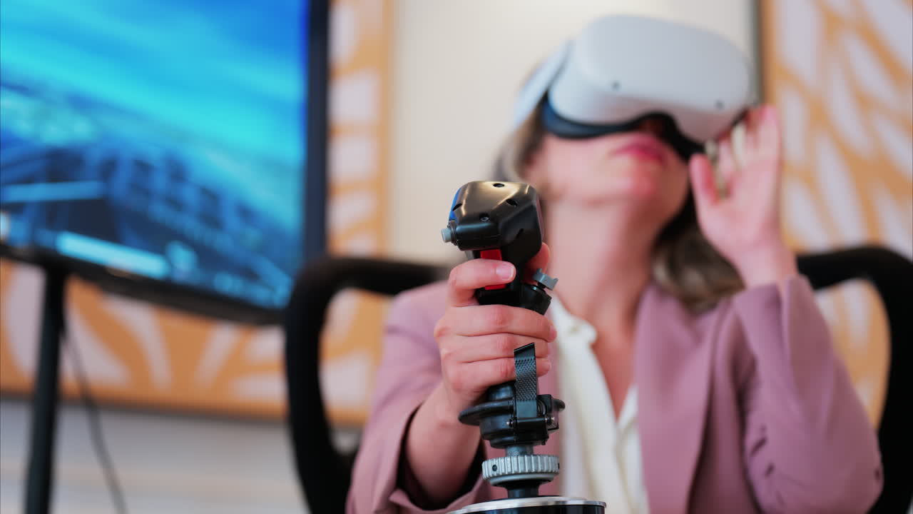 Woman wearing a Virtual Reality headset, playing games, holding a handle