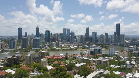 panoramic aerial establishing overview of brisbane skyline and suburb with river