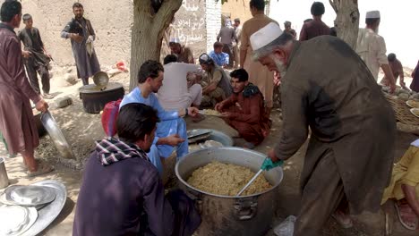 rice from pot to tray in rural weddings