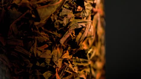 black long-term tea brewed in french-press glass column - close-up