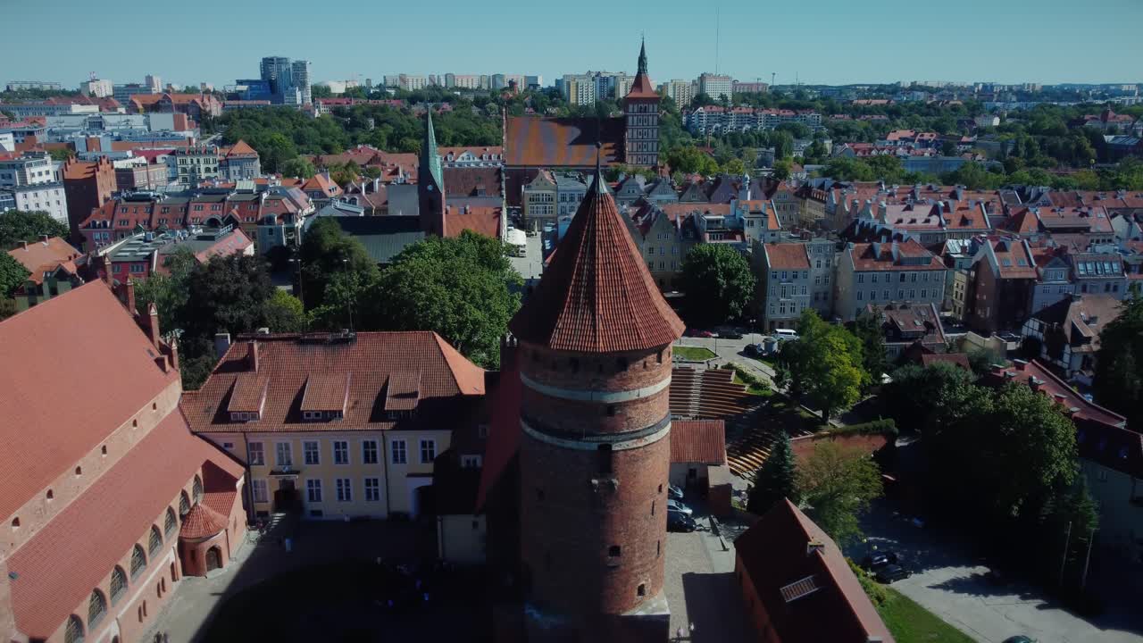 Medieval Castle with an Old Watch Tower and Amphitheatre in the background, aerial shot