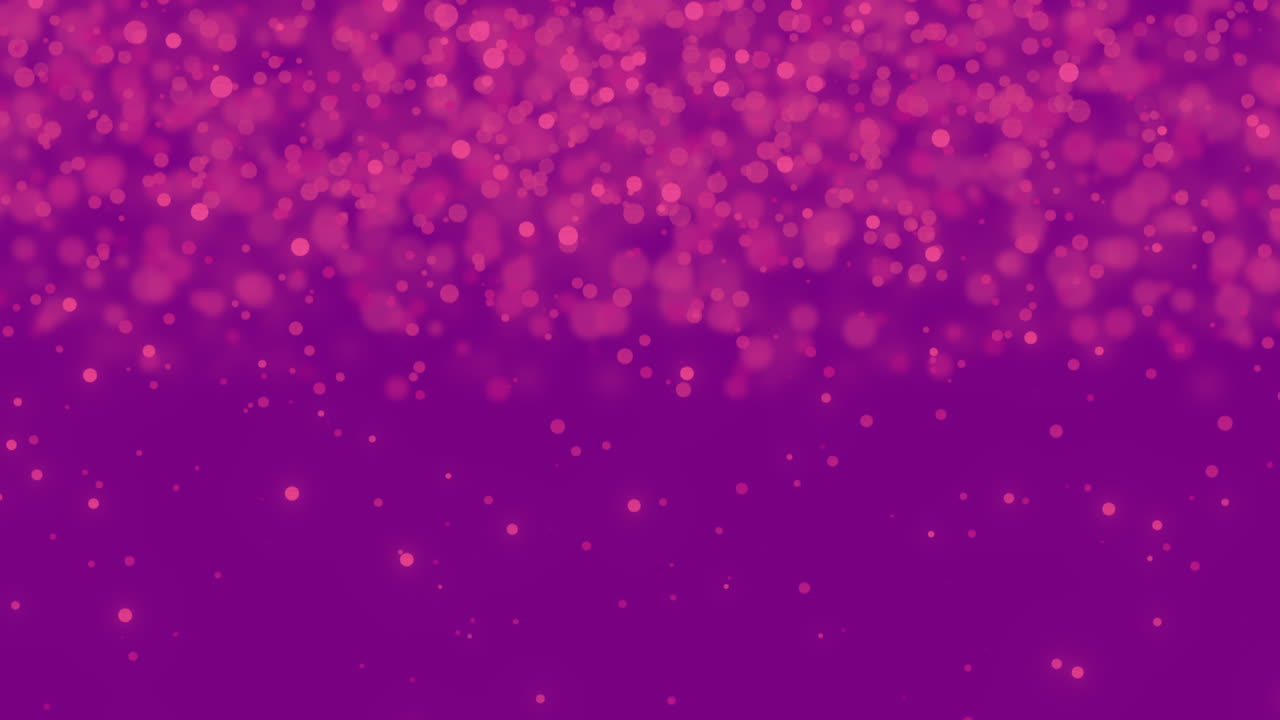 manchas rosadas brillantes que se mueven contra un fondo púrpura