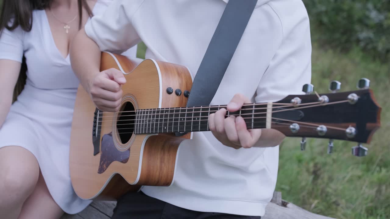 Couple enjoying music together outdoors