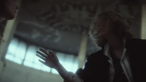 expressive dance and contemplation in an ornate abandoned building