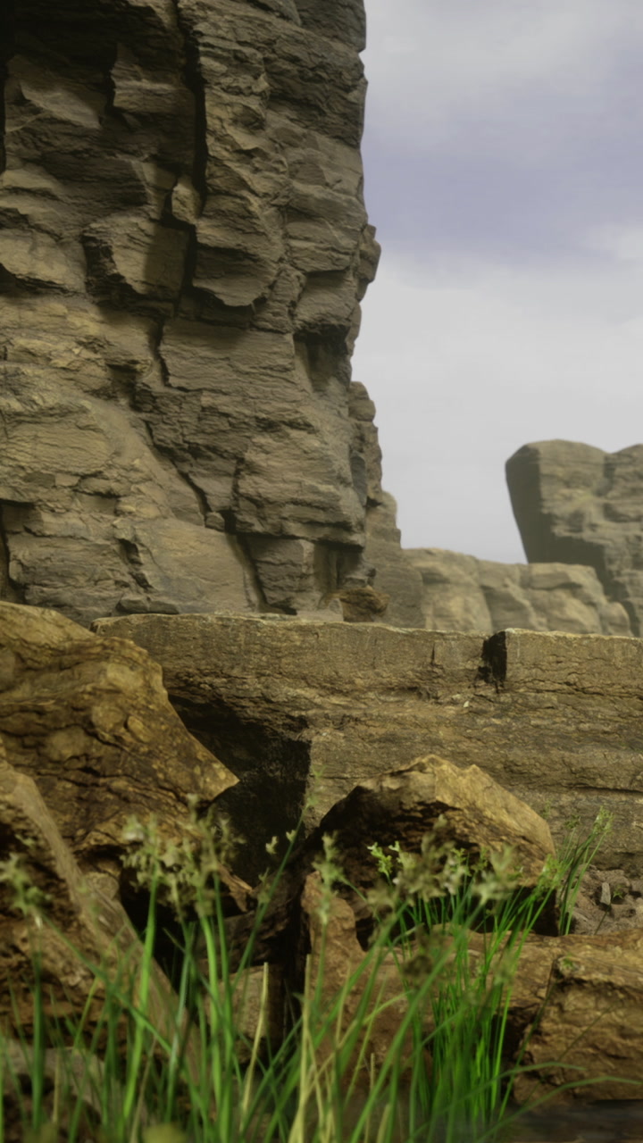 Rugged cliffs cradle a serene landscape with wild grasses swaying gently