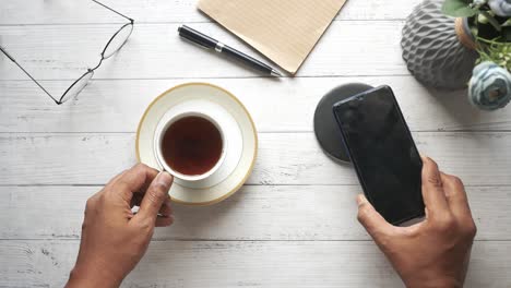 workspace with coffee and wireless charging