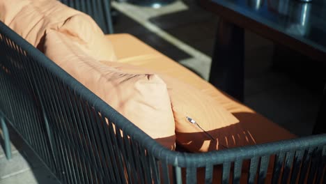 close up of an outdoor couch with brown cushions